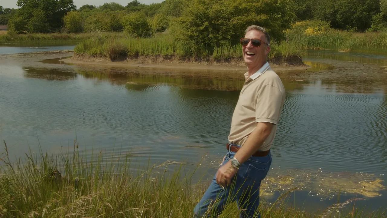 Standing beside a lake in the countryside